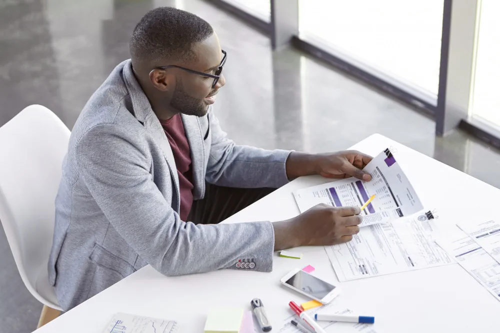 Professional reviewing project documents representing project management